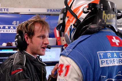 Race driver talking to member of the team during a race - Race Car Preperation